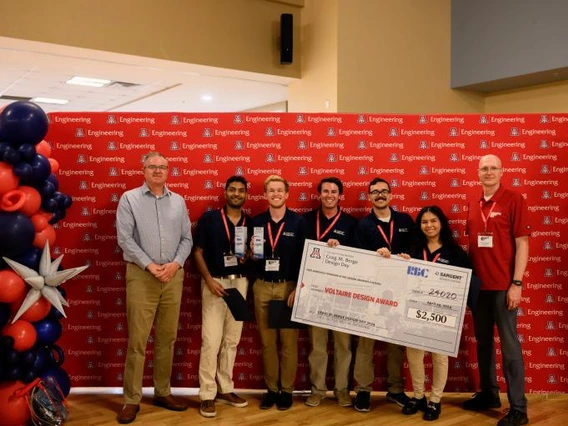 Team 24020 celebrates their $2,500 prize for the RBC Sargent Aerospace & Defense Voltaire Design Award.