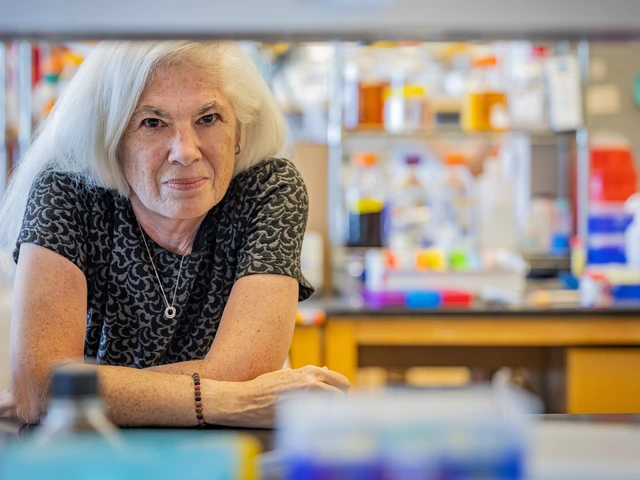 A women poses behind lab equipment