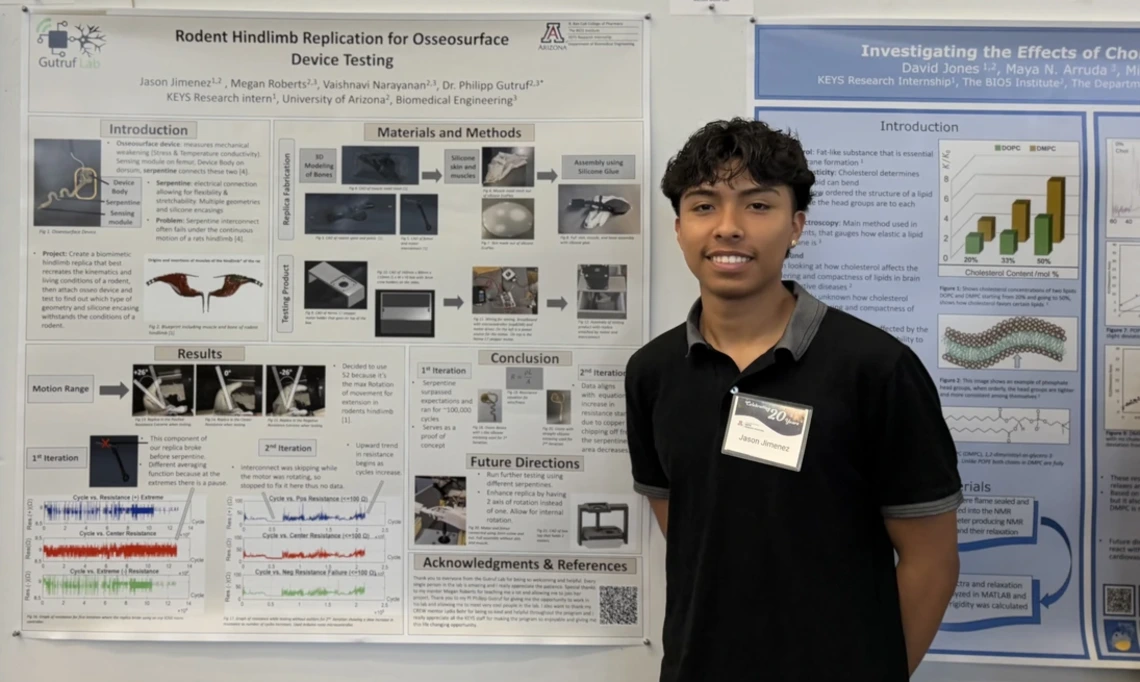 BASIS Tucson North graduate Jason Jimenez tests a device that binds to bone with mentor Philipp Gutruf, associate department head and associate professor of biomedical engineering.