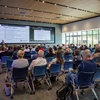 People in a large auditorium.